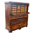 Wooden secretary desk with carved details and internal drawers