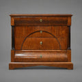 Antique wooden chest of drawers with arched facade and columns