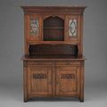Solid oak sideboard with carvings and decorative glass doors