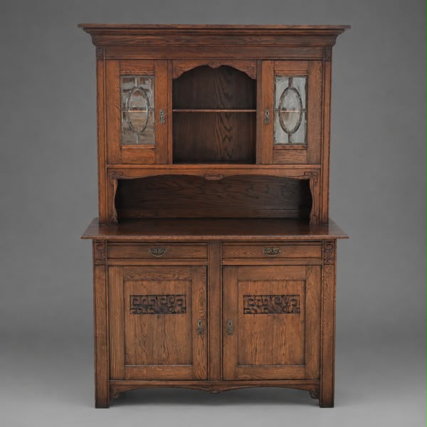 Solid oak sideboard with carvings and decorative glass doors