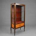 Vintage Louis XVI style display cabinet with brass elements