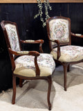 A pair of Rococo style armchairs.