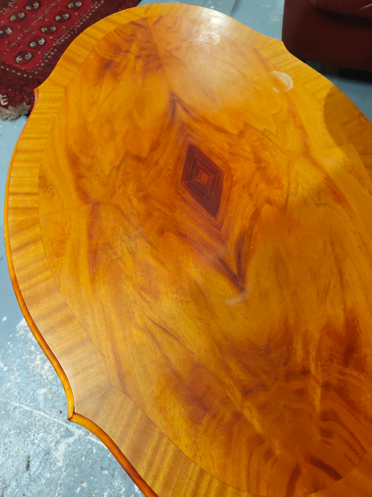 Burl veneer accent table with pedestal base