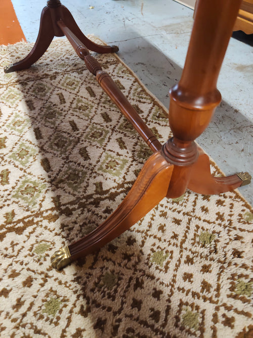 Classic wood coffee table with brass paw feet