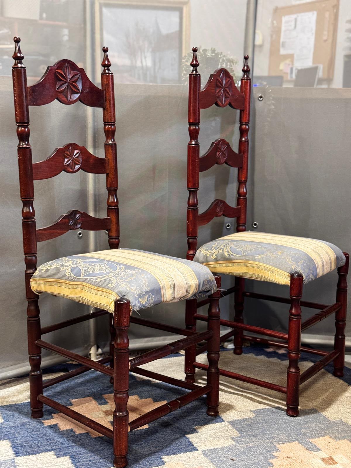 Set of two Neo-Gothic style reddish brown wooden dining chairs