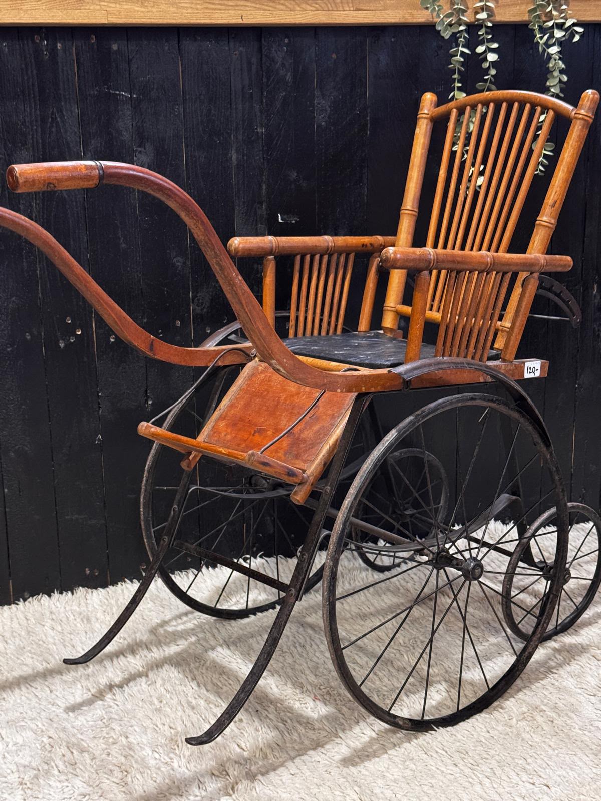 Antique wooden and wrought iron pushchair